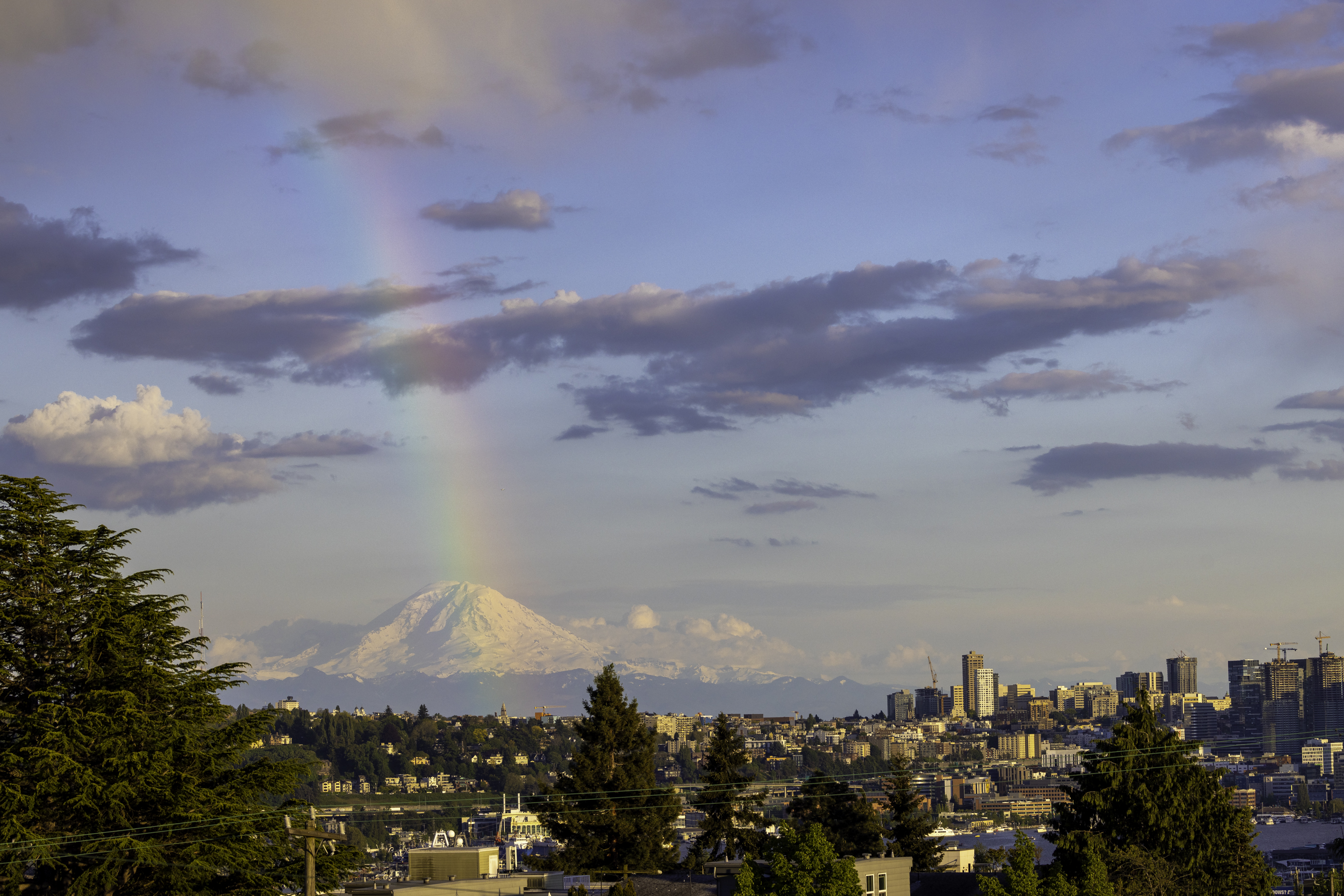 Rainbow arcing over Mount Rainier as seen from the rooftop patio